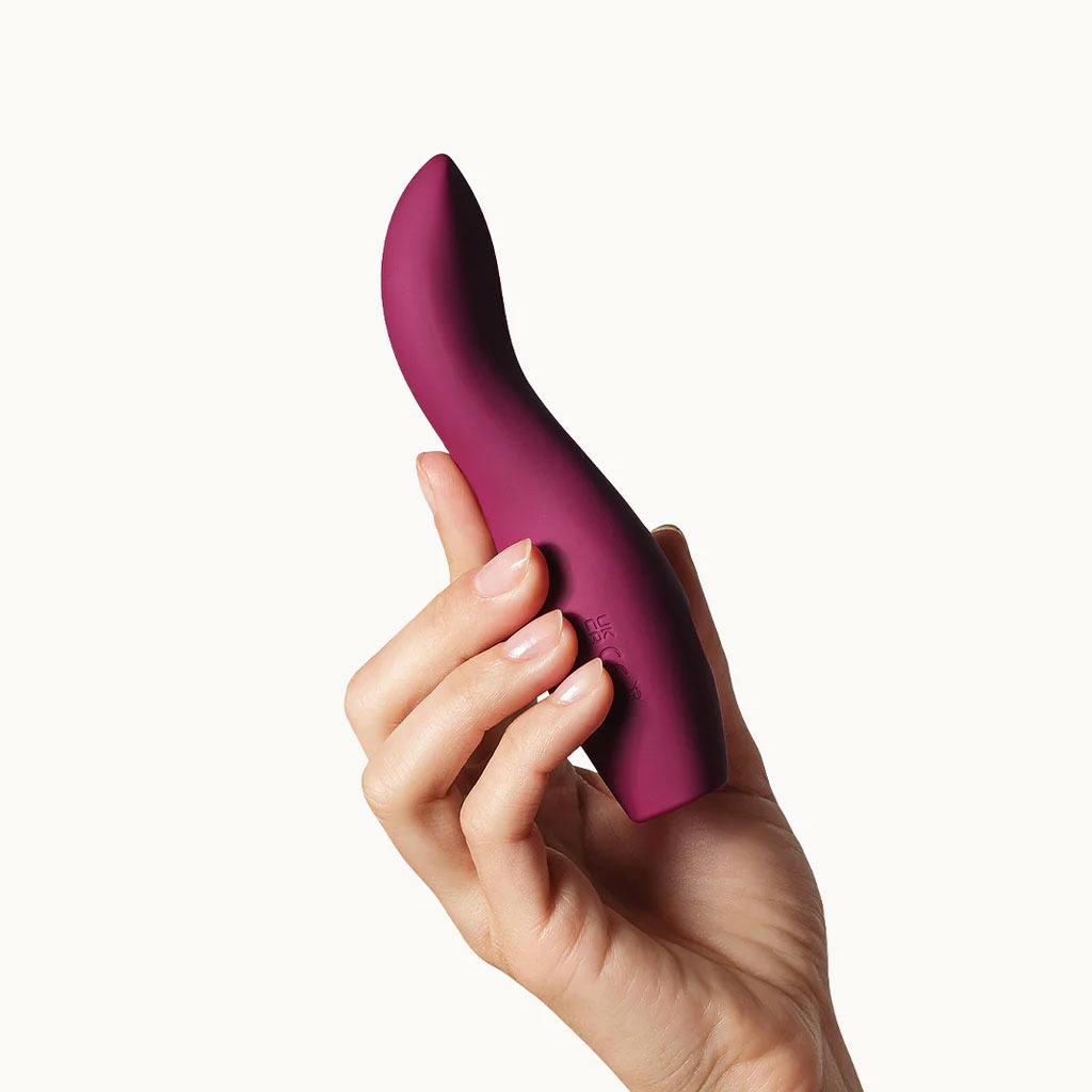 DAME products - Dip 2 Basic Vibrator Plum hand