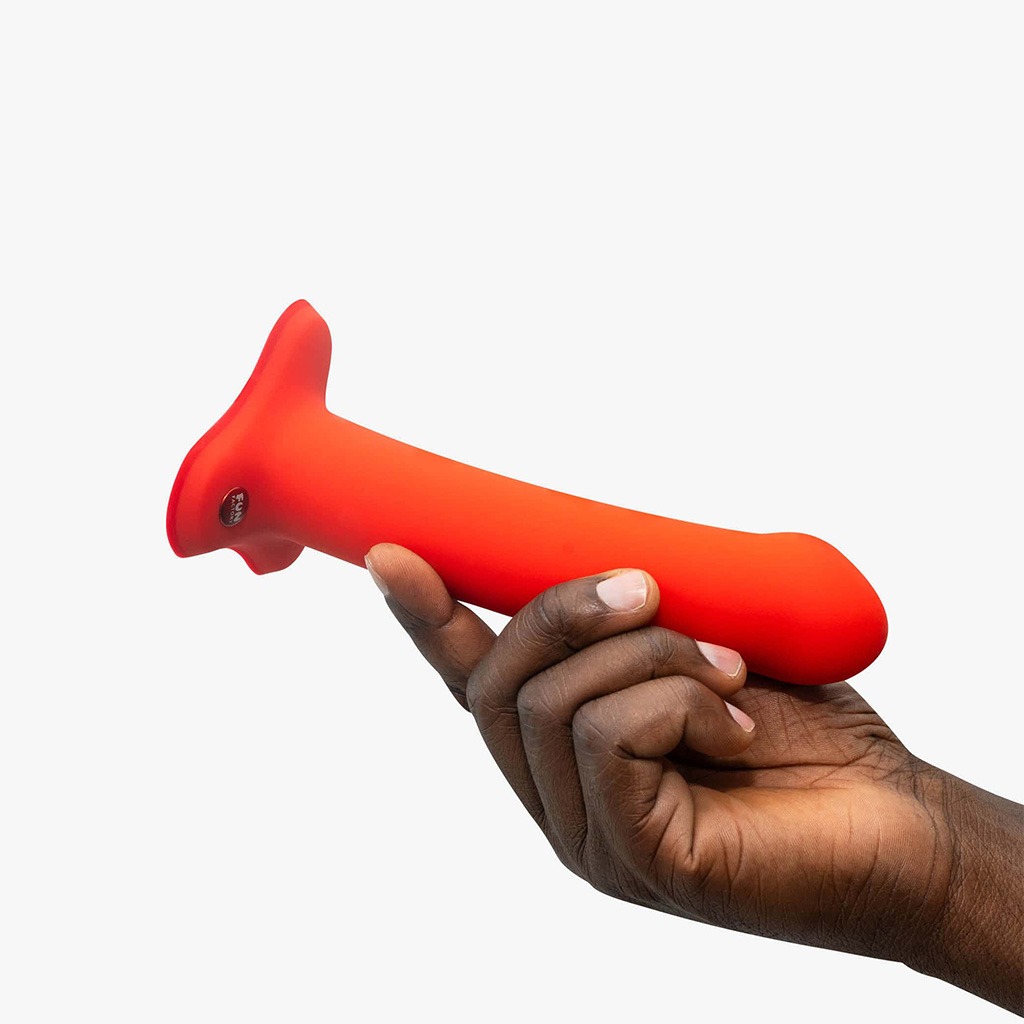 Factory Magnum Dildo flashy coral in hand